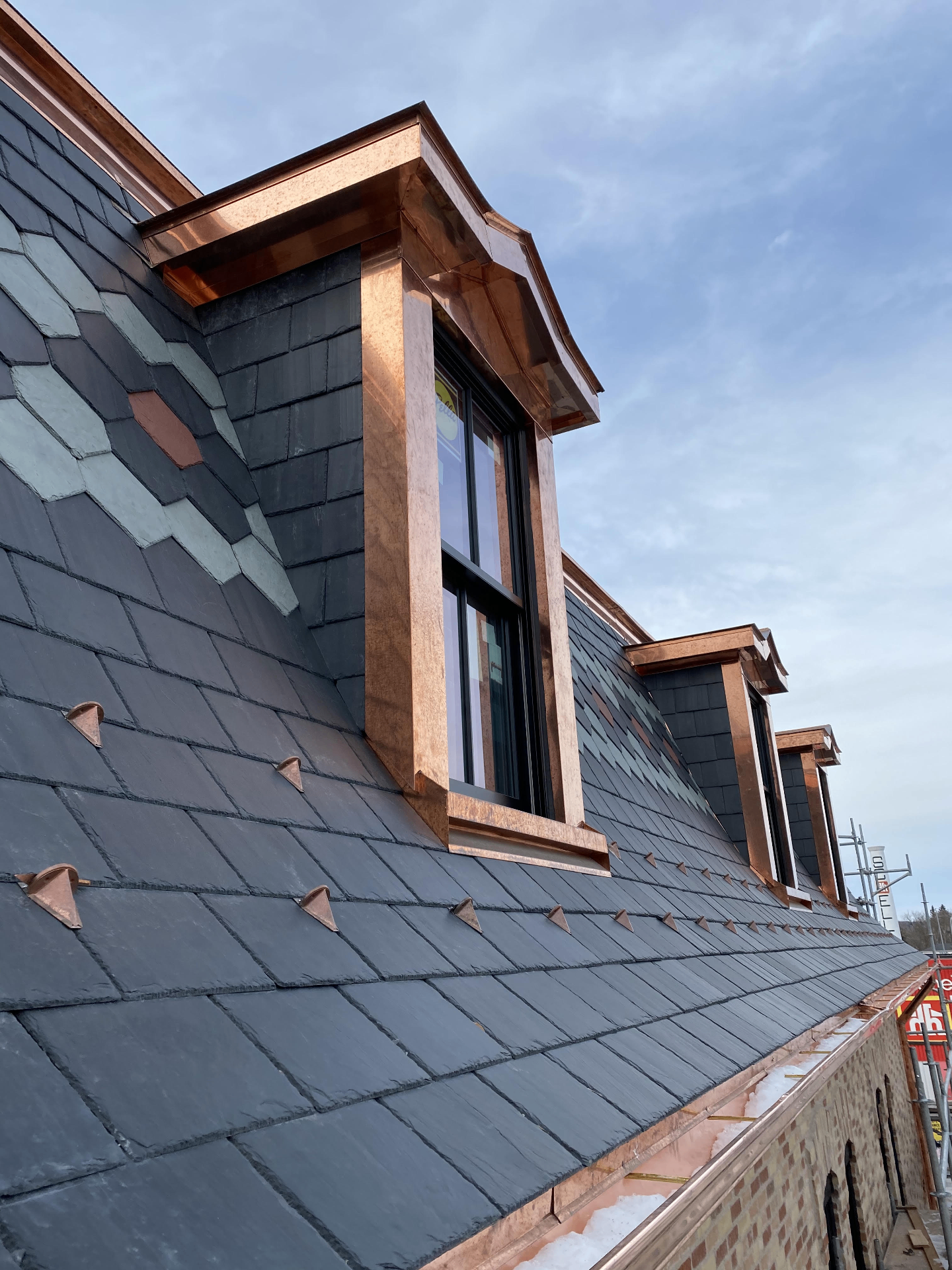 Natural slate roof with hand-formed copper dormers, flashings and gutter